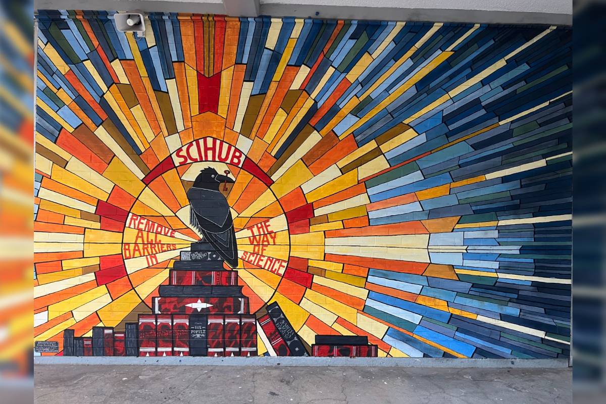 Mural en la Facultad de Ciencias de la UNAM, en el cual se aprecia un cuervo parado sobre algunos libros y en su pico sostiene una llave. 